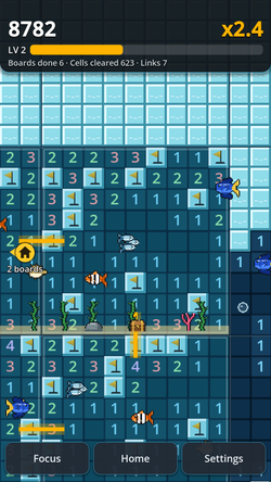 Ocean gameplay with completed boards and ambient sea creatures.